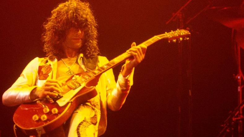 Jimmy Page performs with Led Zeppelin at Madison Square Garden in 1977.